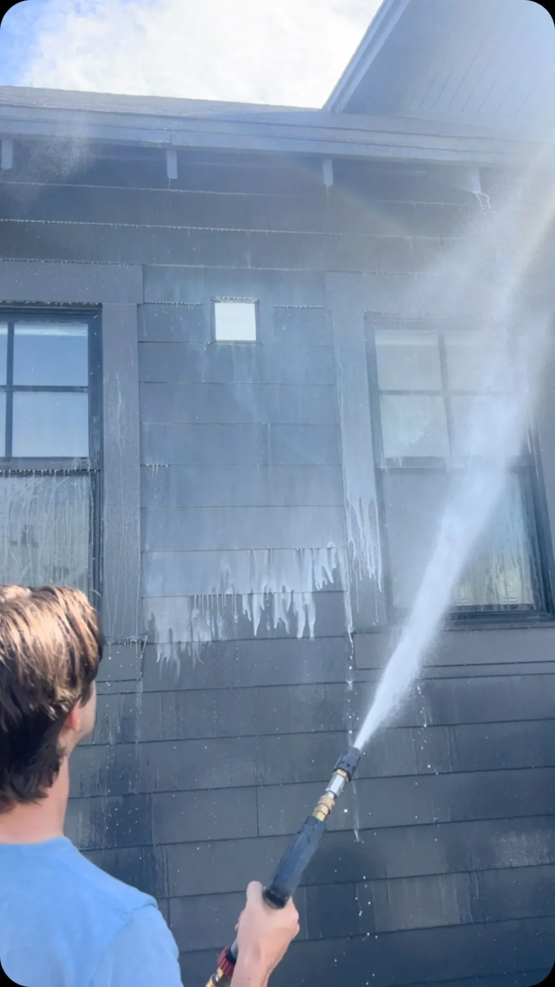 Soft washing dark shake siding on a Utah home